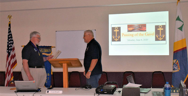 Grand Knight Eddie Williams (left) Initiates a Ceremony of the Passing of the Gavel to  Grand Knight Elect George Brown